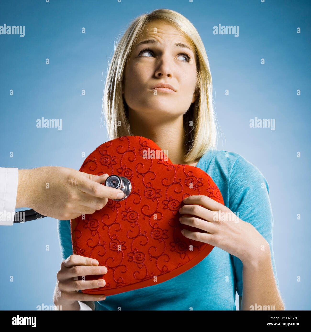 woman holding an oversized heart Stock Photo