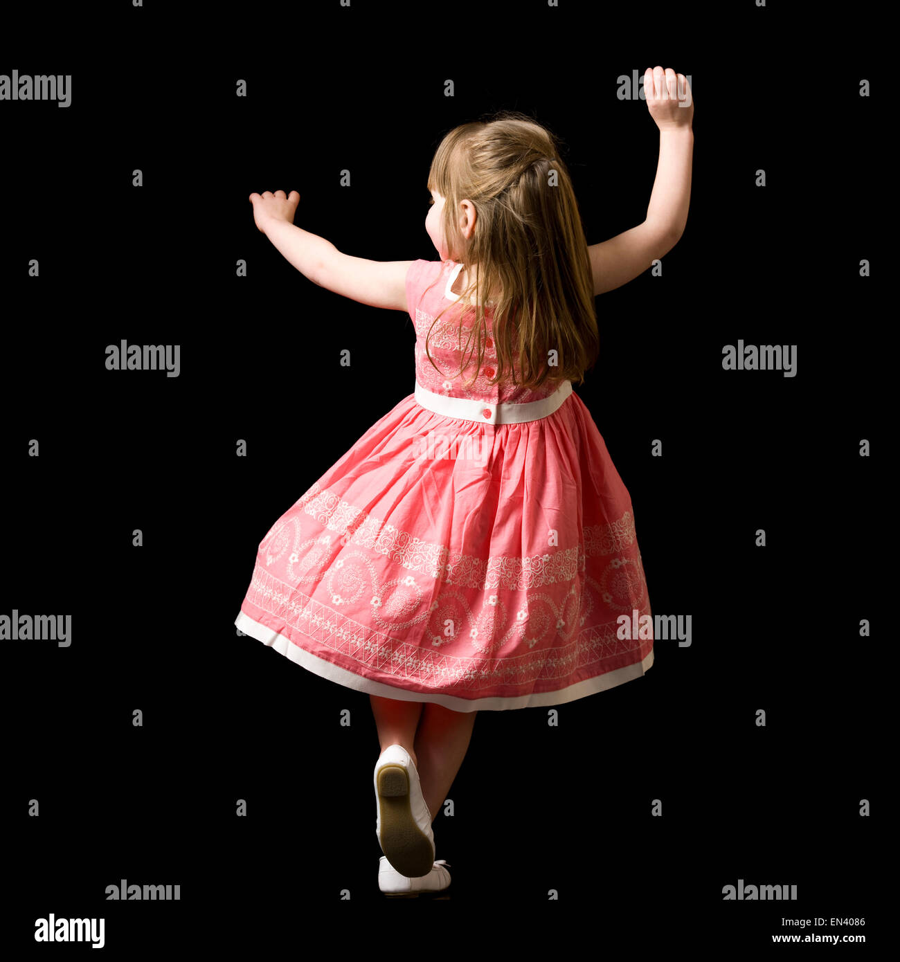 girl dancing in a red dress Stock Photo