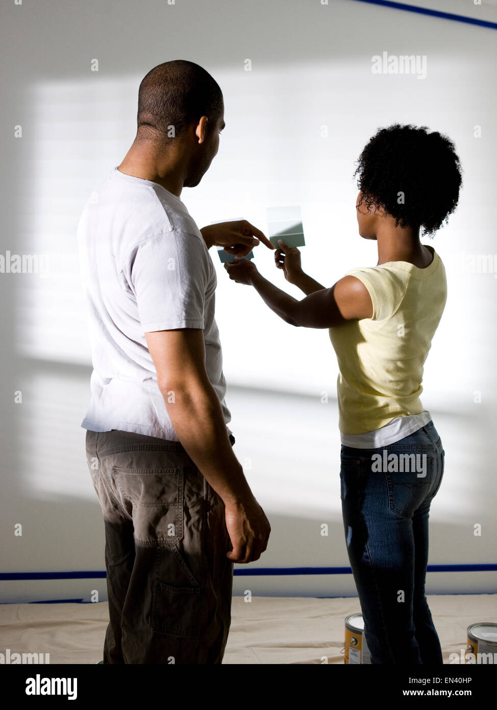 couple choosing a color to paint a room Stock Photo - Alamy