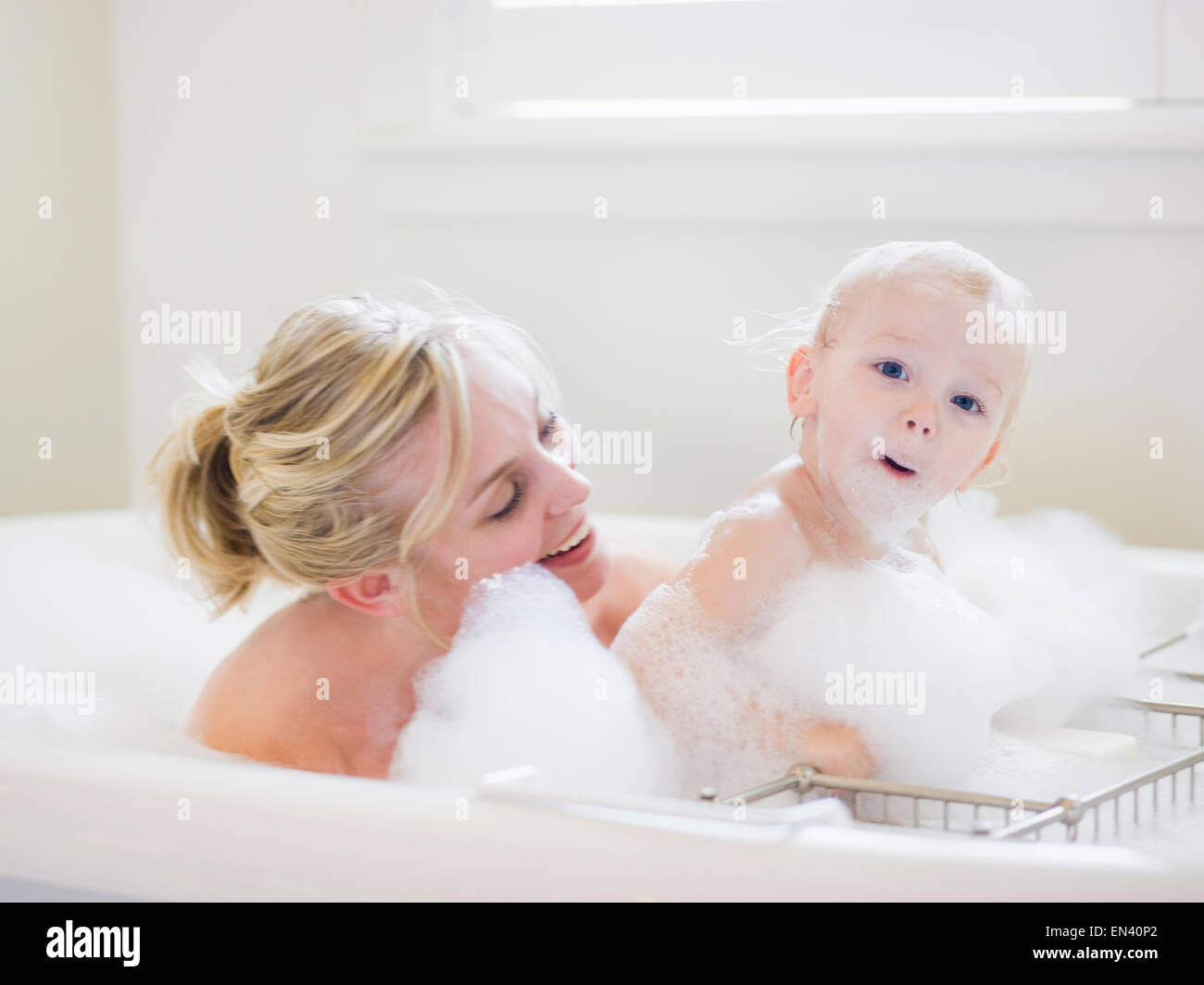 mother and baby taking a bubble bath Stock Photo Alamy