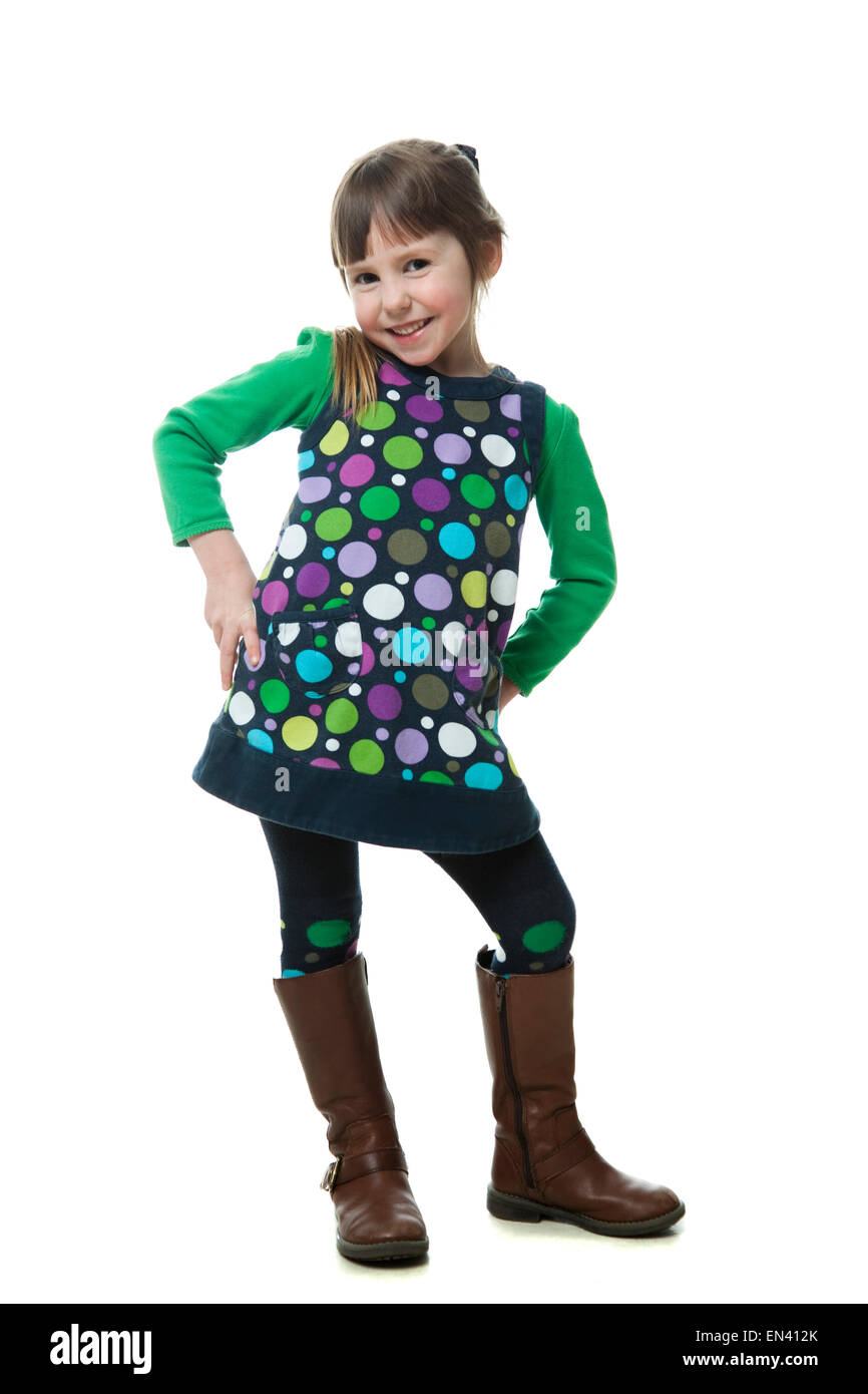 Studio portrait of girl (4-5) with hands on hips Stock Photo
