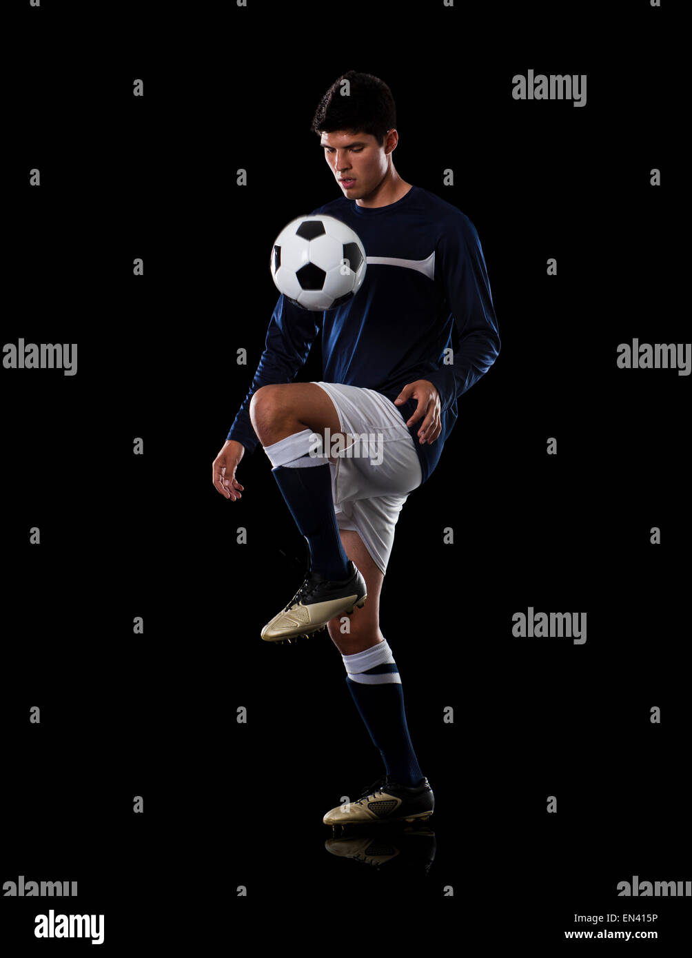 Soccer player juggling the ball Stock Photo Alamy