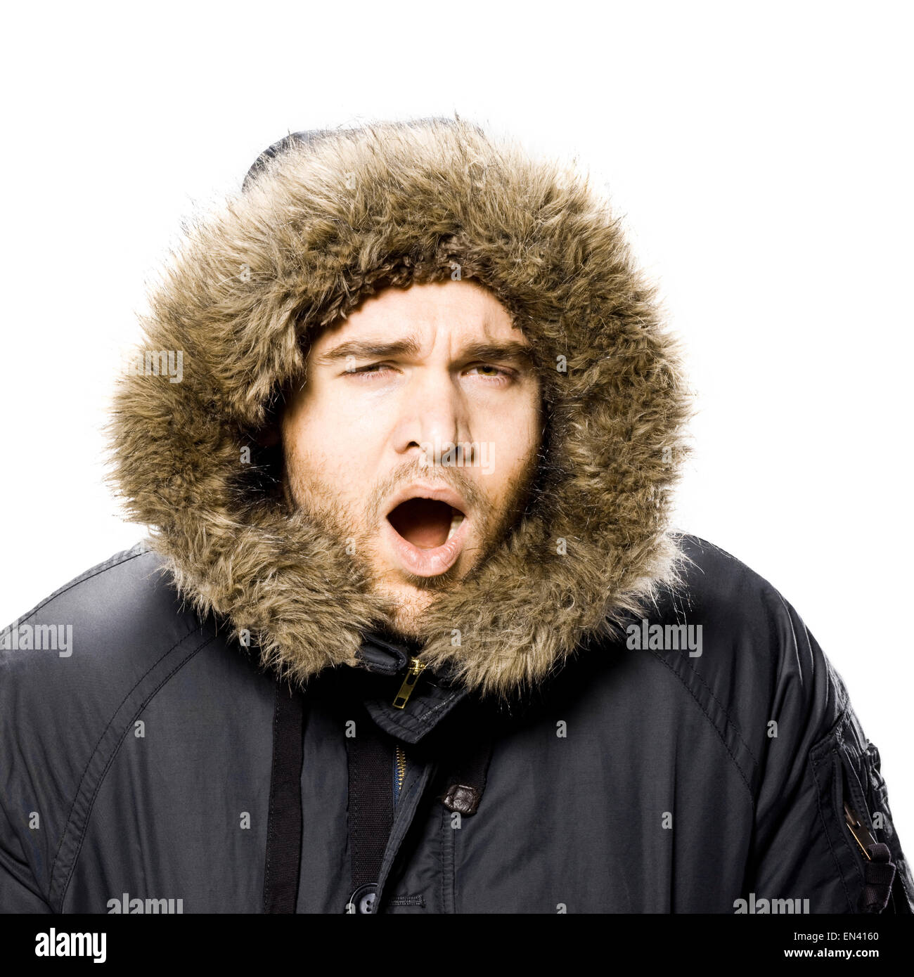 man wearing a winter coat with a fur trimmed hood Stock Photo Alamy
