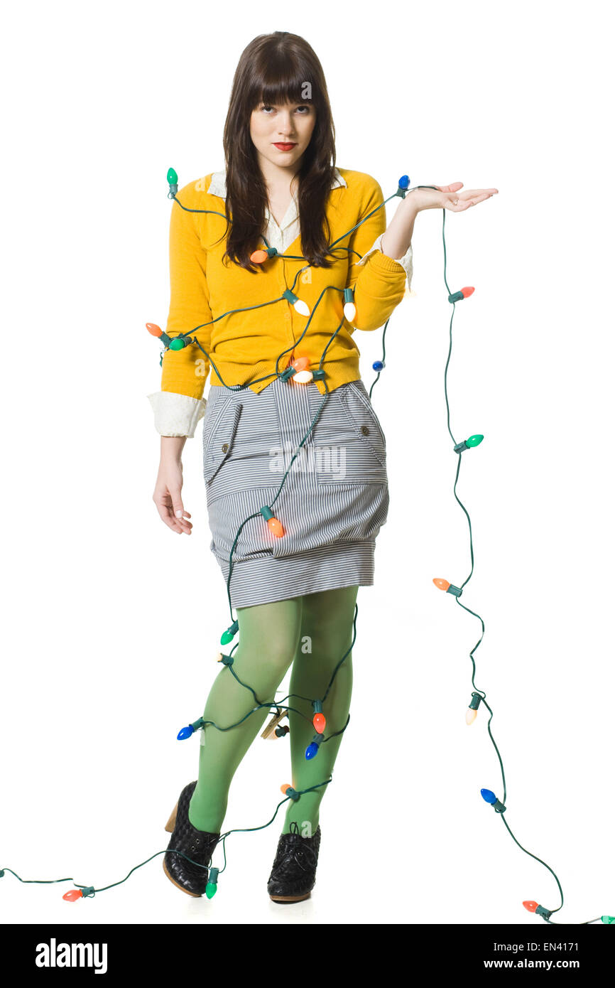 woman wrapped up in christmas lights Stock Photo Alamy