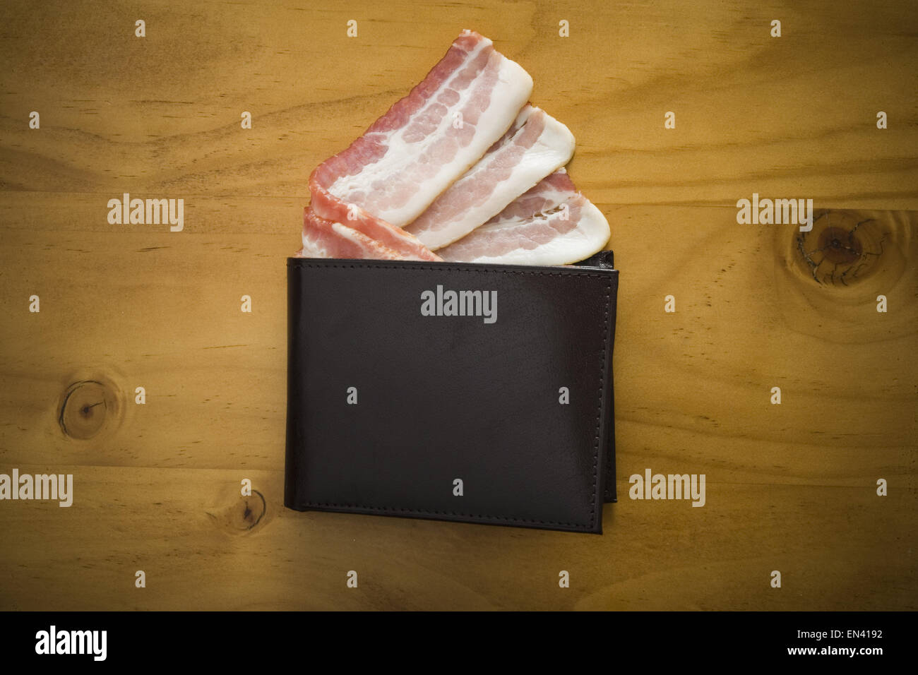 Billfold with strips of bacon Stock Photo