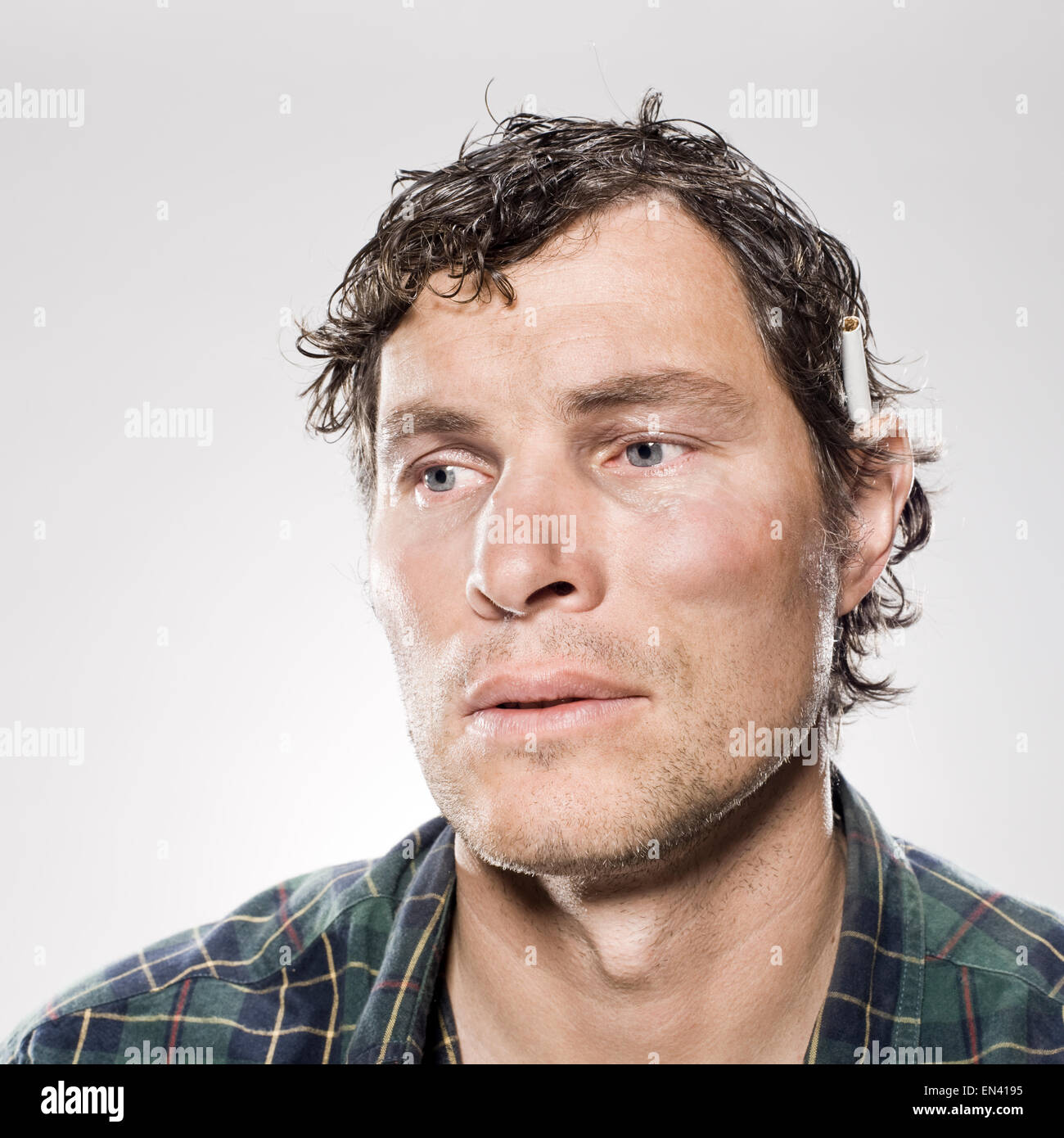 White trash man with a cigarette behind his ear Stock Photo