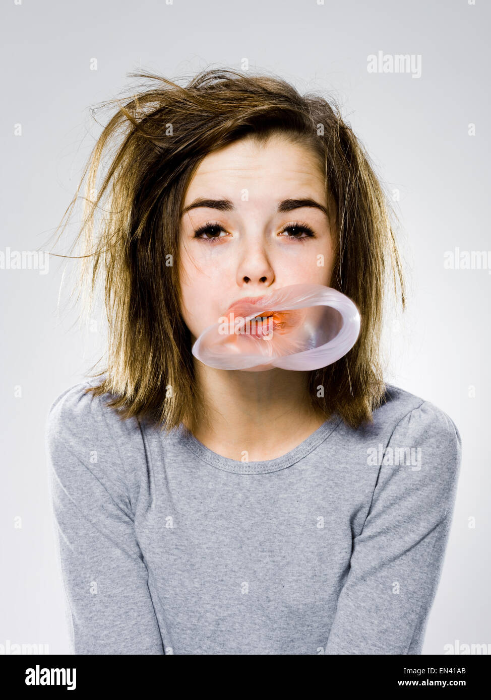 with a appearance popping a bubble gum bubble Stock Alamy