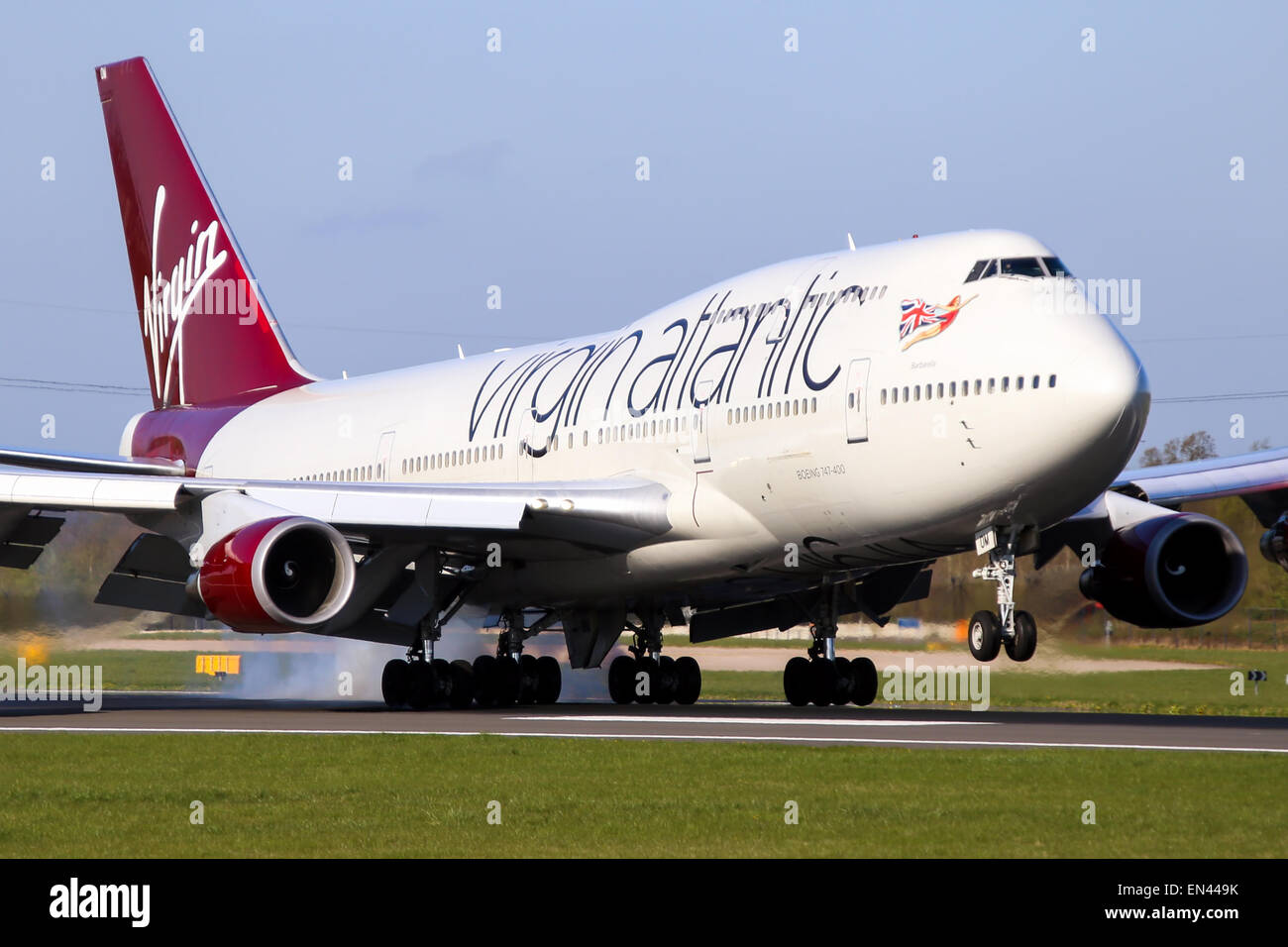 Virgin Atlantic Boeing 747-400 touches down on runway 05R at Manchester airport. Stock Photo
