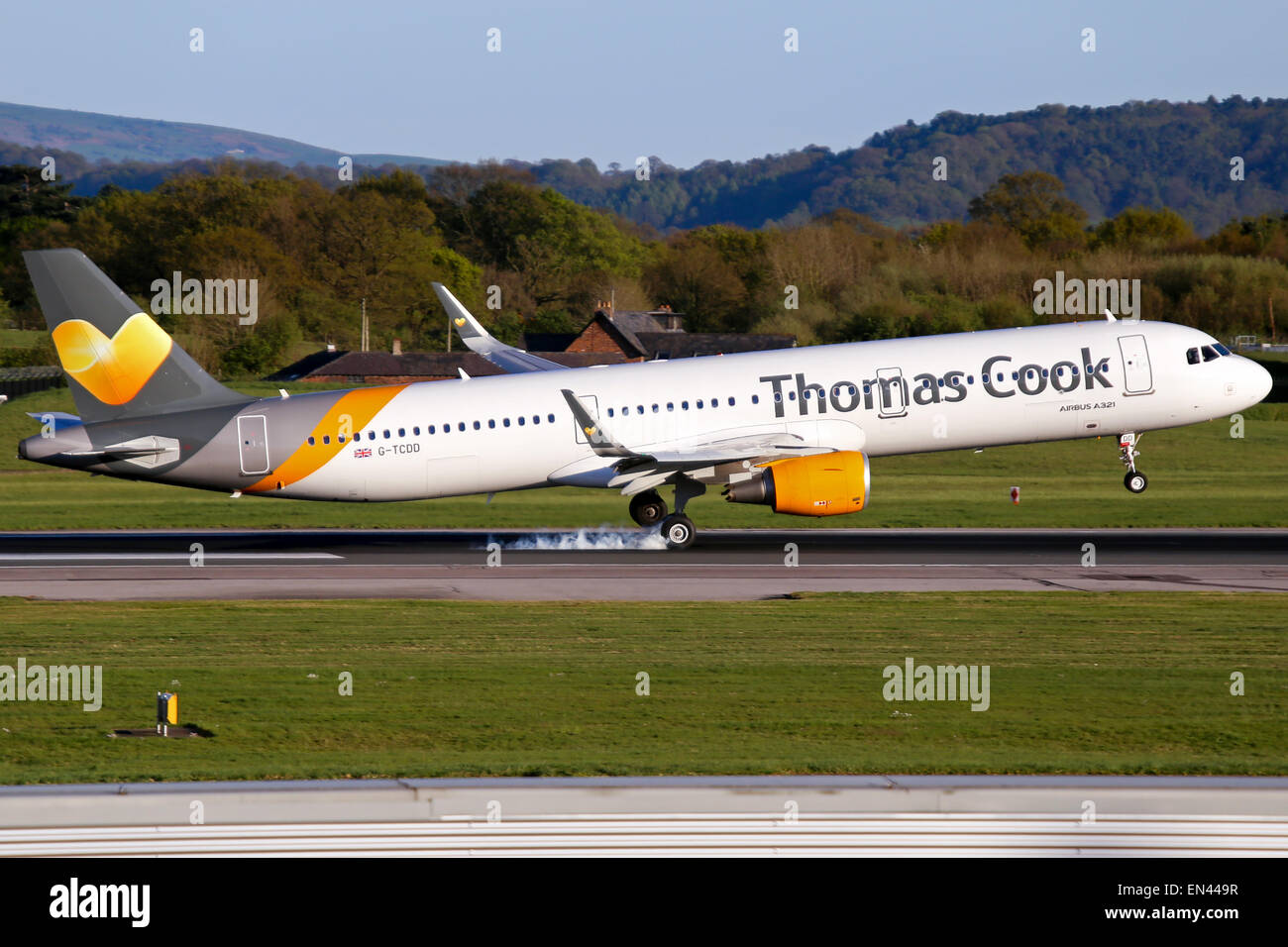 Thomas Cook Airbus A321 touches down on runway 23R at Manchester airport. Stock Photo