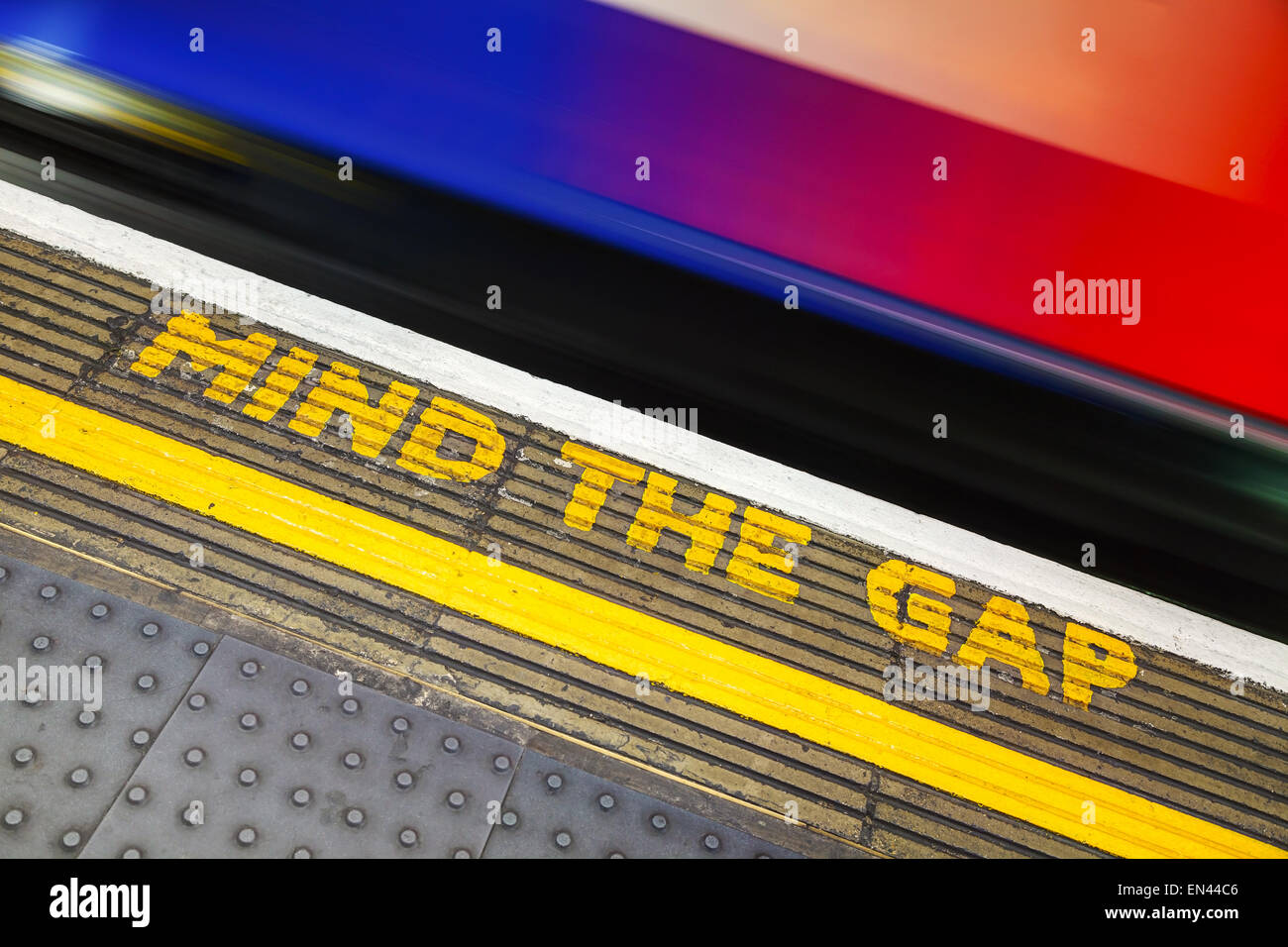 Famous Mind the Gap sign at the underground station in London Stock Photo