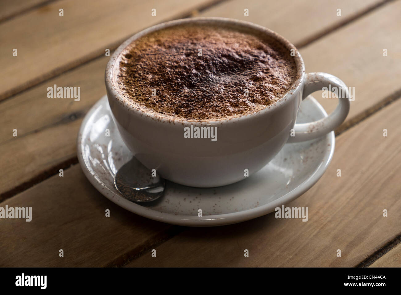 Creamy cappuccino topped with chocolate. Stock Photo