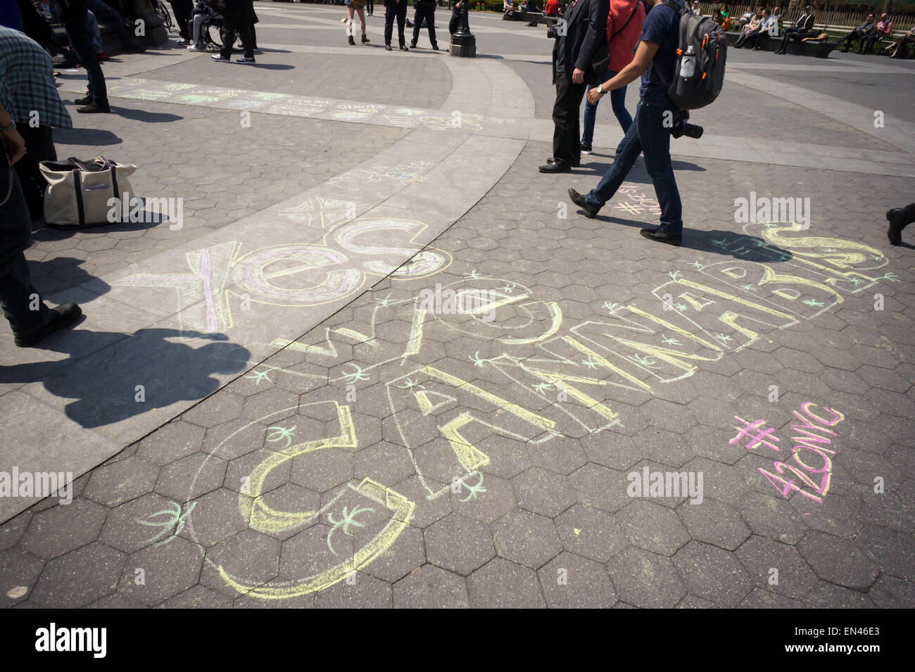 Advocates for the legalization of marijuana chalk up Washington Square Park in Greenwich Village in New York to celebrate 420 Day, a day late, on Tuesday, April 21, 2015. The tokers moved the celebration to the next day due to inclement weather. (© Richard B. Levine) Stock Photo