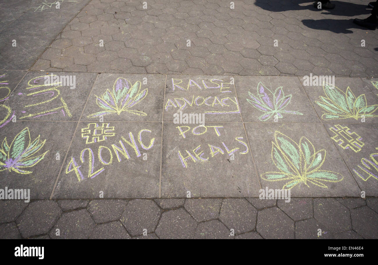 Advocates for the legalization of marijuana chalk up Washington Square Park in Greenwich Village in New York to celebrate 420 Day, a day late, on Tuesday, April 21, 2015. The tokers moved the celebration to the next day due to inclement weather. (© Richard B. Levine) Stock Photo