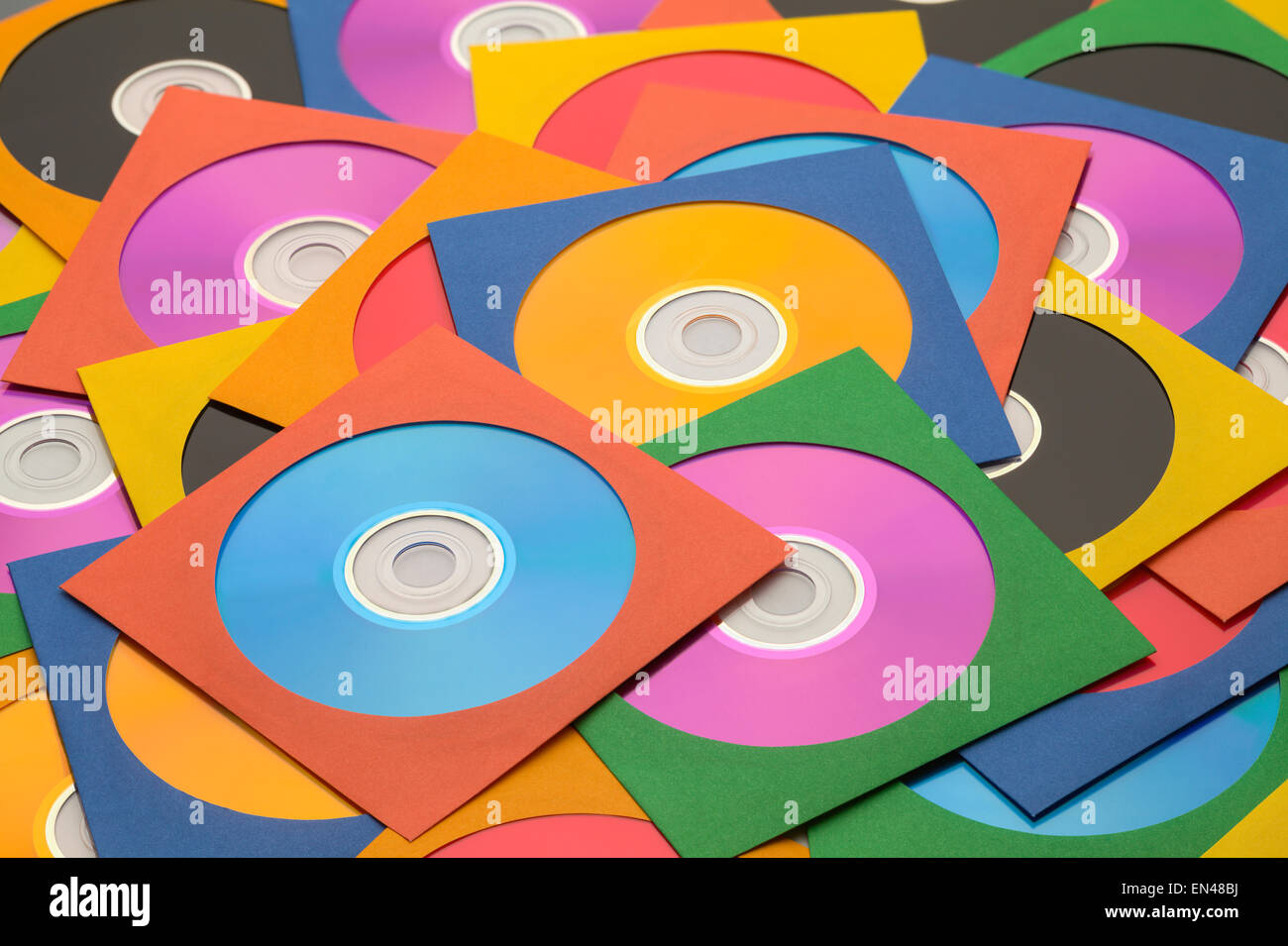 Many Discs in Cases in a large Messy Pile. Stock Photo