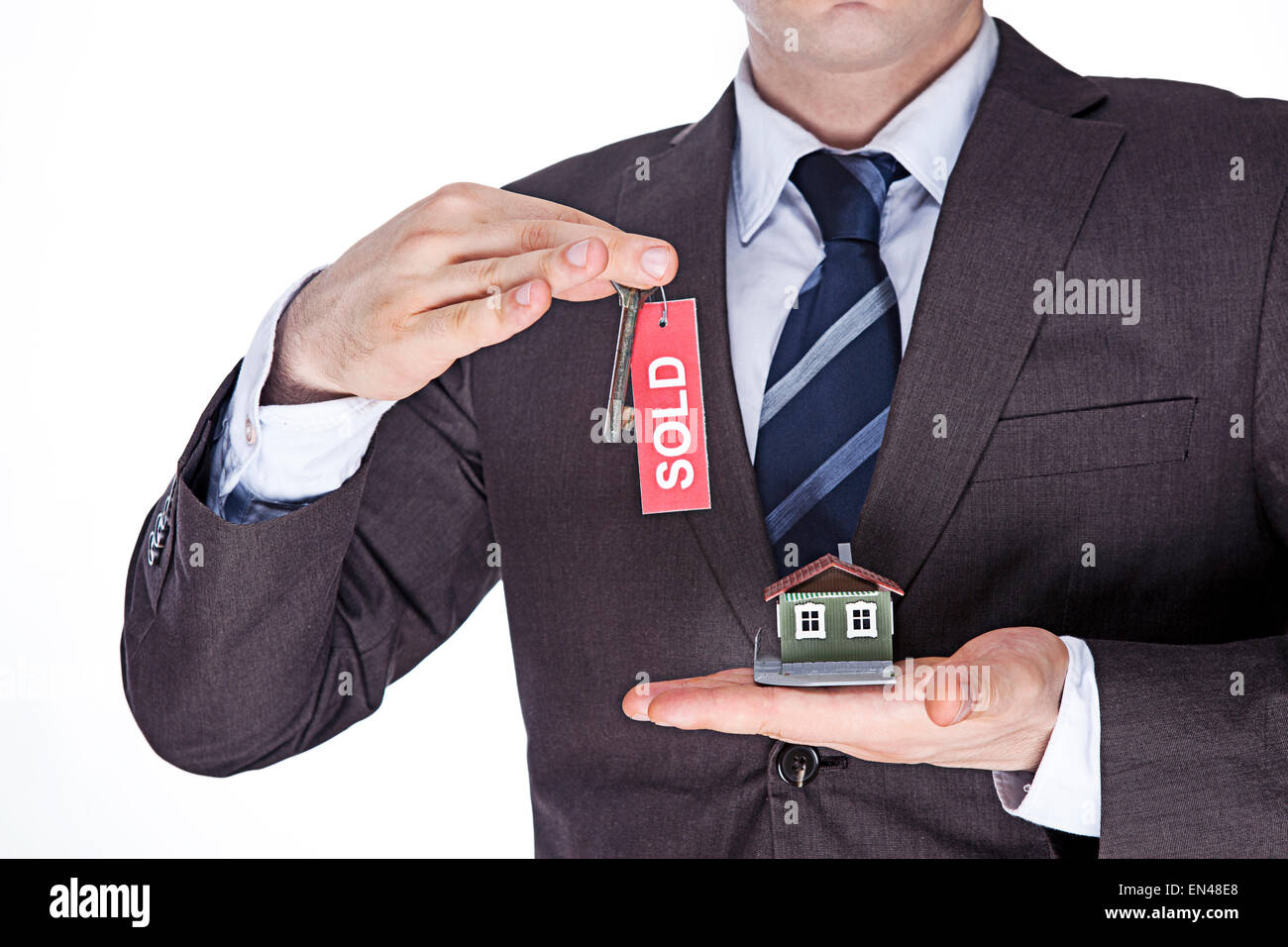 Male holding model house with key in hand Stock Photo - Alamy