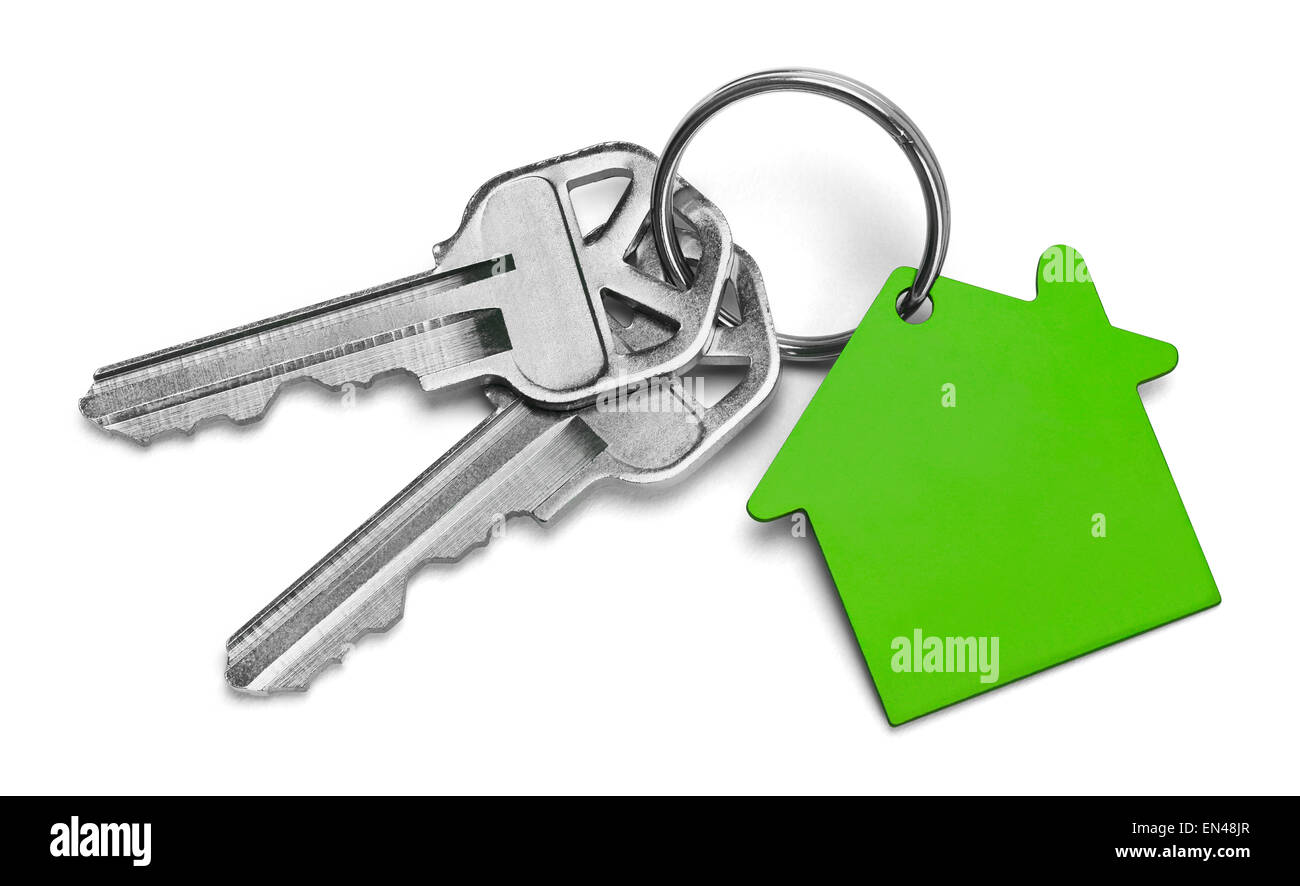 Set of Keys With Green House Isolated on White Background. Stock Photo
