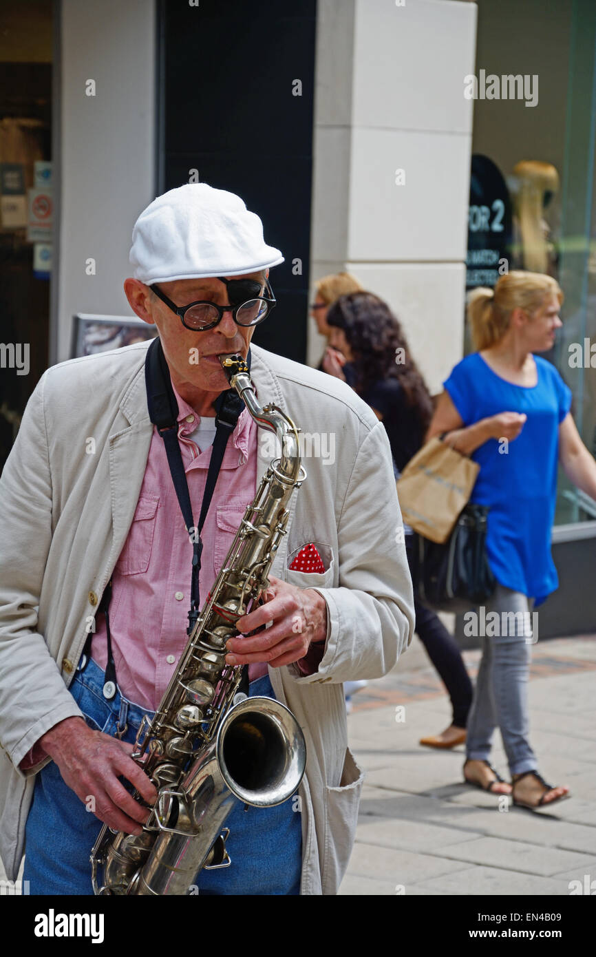 Man playing saxophone in street, Nottingham, England. Stock Photo