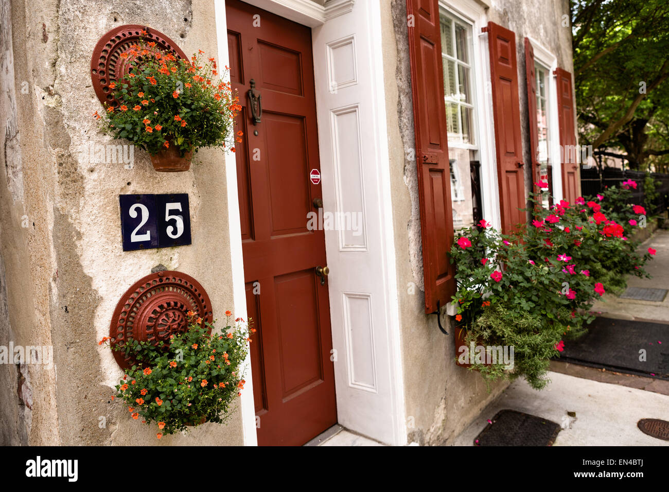 Flowers blooming in window boxes along Queen Street in historic