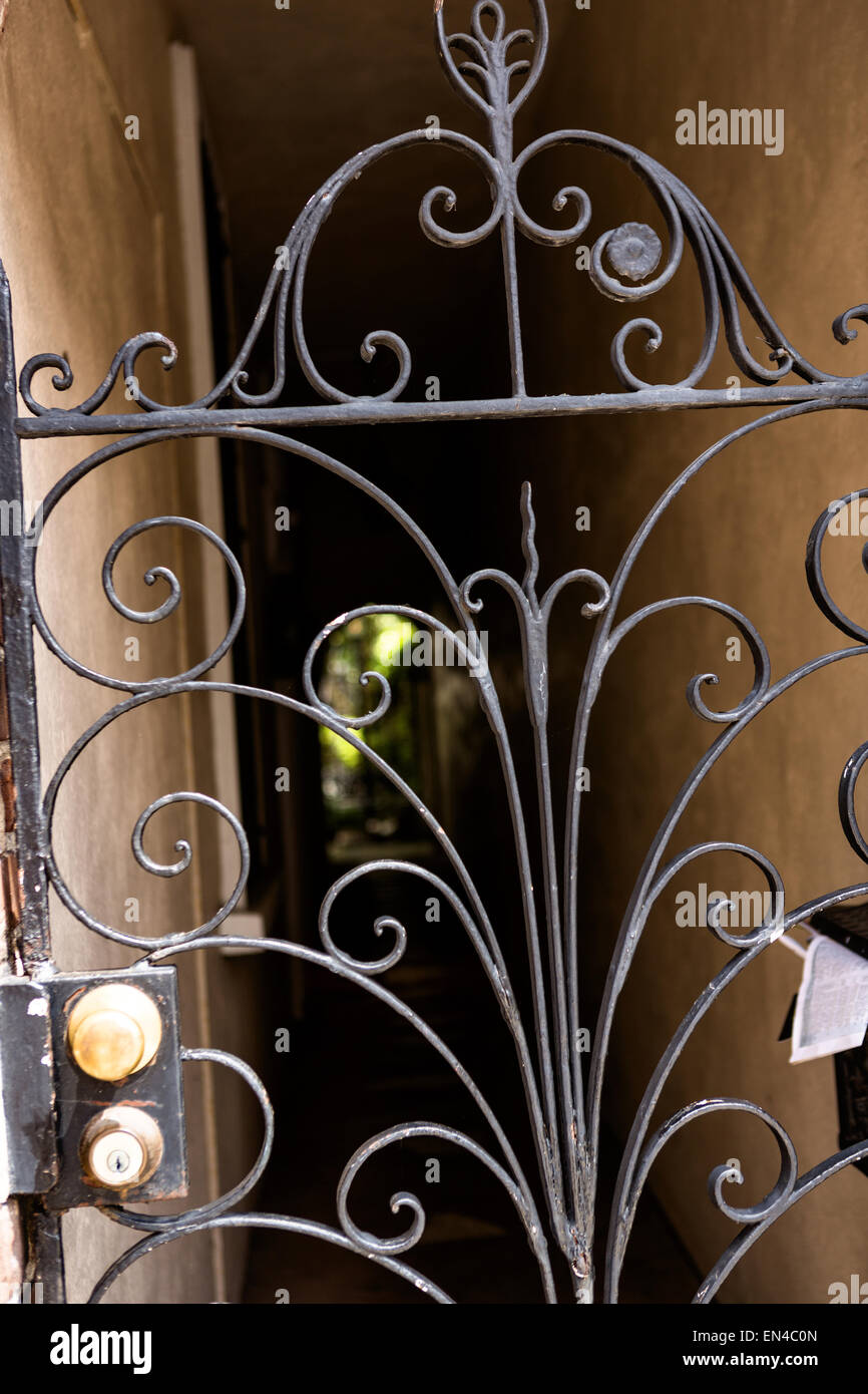 A wrought iron gate at a home on Queen Street in historic Charleston