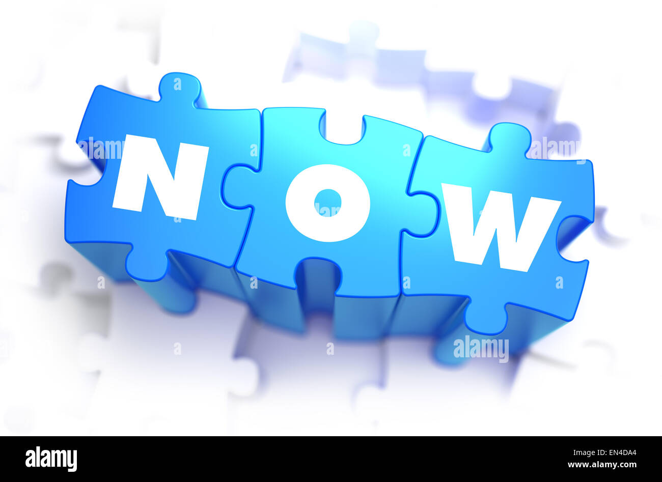 Now - Text on Blue Puzzles. Stock Photo