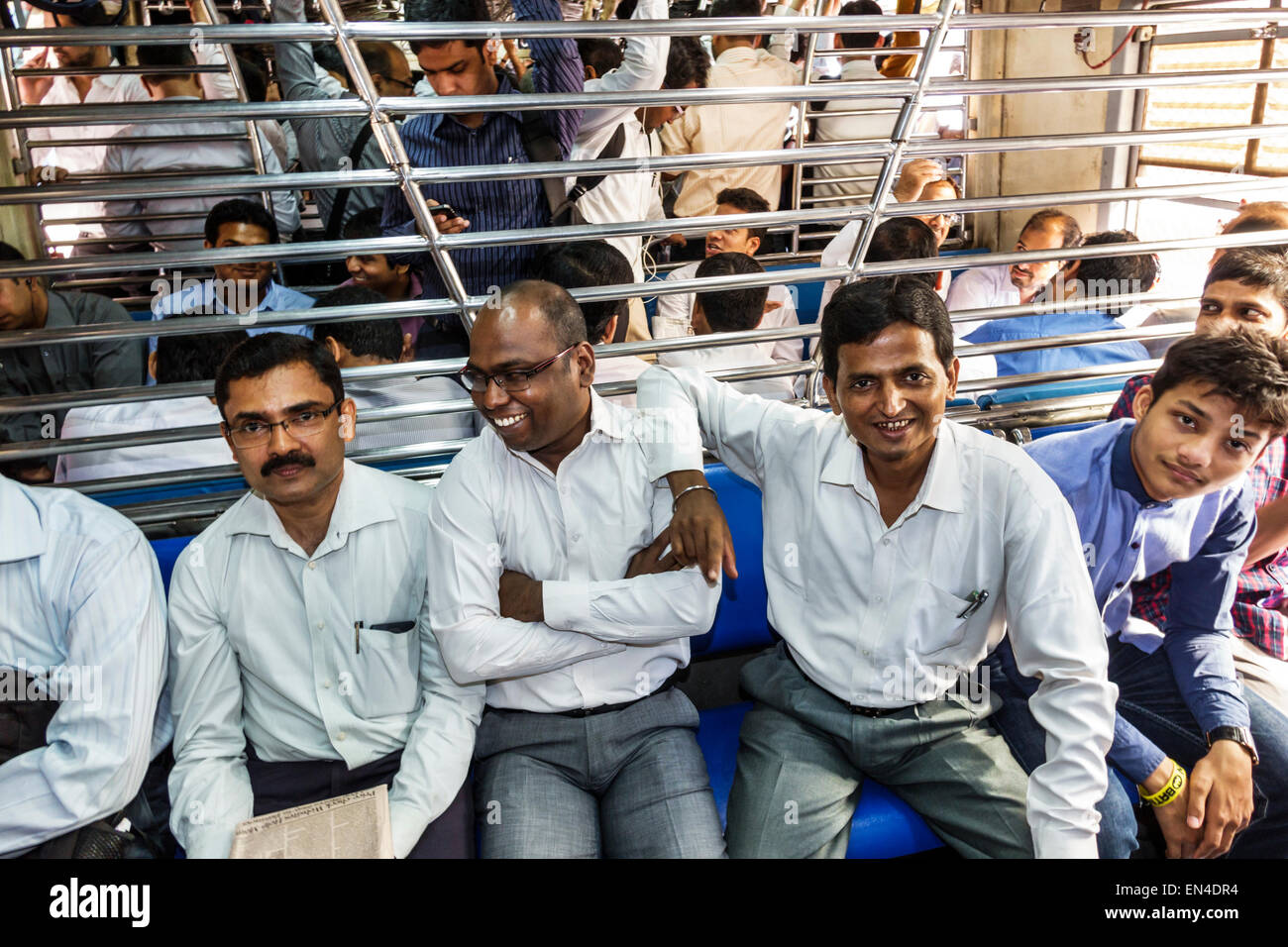 Mumbai India,Asian Andheri Railway Station,Western Line,train,commuters,riders,passenger passengers rider riders,man men male,2nd class cabin,sitting, Stock Photo