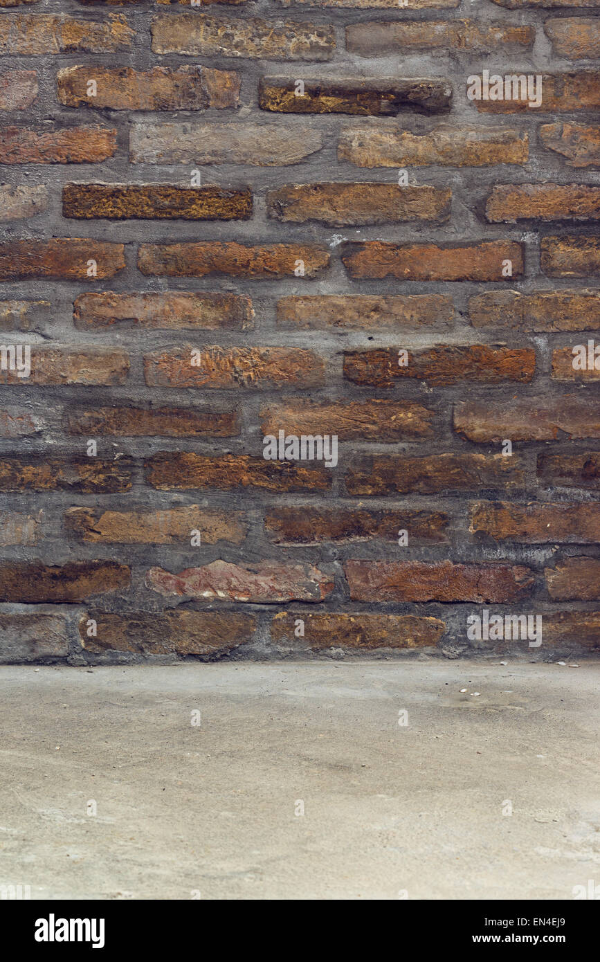 Brickwall Texture with Concrete Floor as Background for Product Placement Mock-up Stock Photo