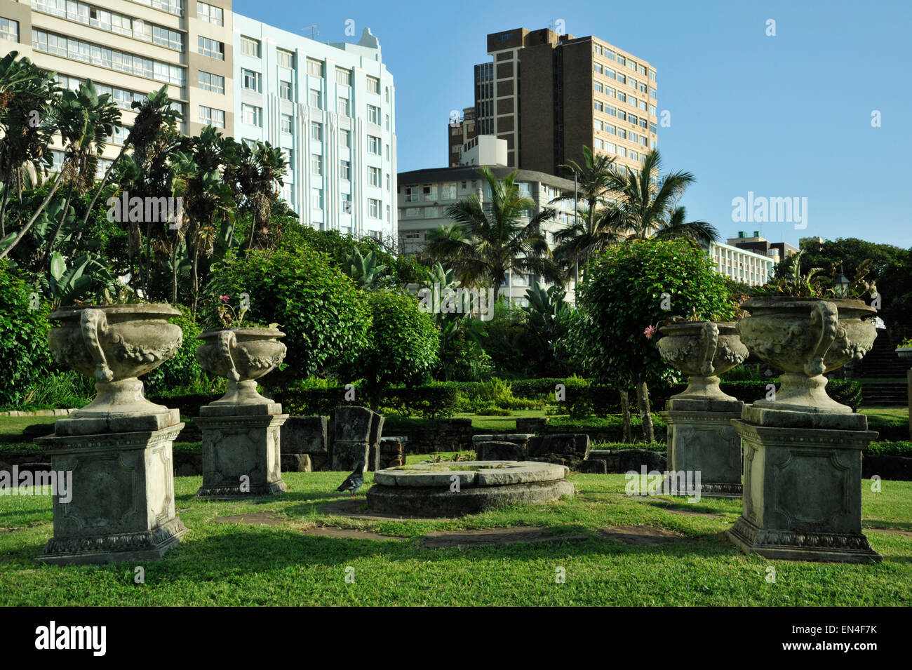 Four weathered flower pots in historical sunken gardens built by