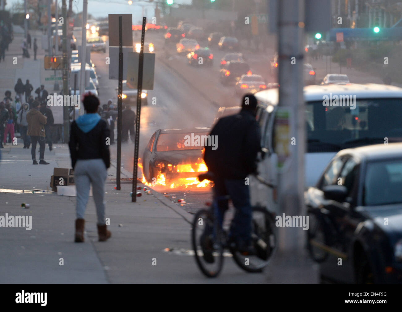 Baltimore, USA. 27th Apr, 2015. A car burns in Baltimore, Maryland, the United States, April 27, 2015. Maryland governor Larry Hogan Monday evening declared a state of emergency and activated the National Guard to address the escalating violence and unrest in Baltimore City following the funeral of a 25-year-old black man who died after he was injured in police custody. Credit:  Yin Bogu/Xinhua/Alamy Live News Stock Photo