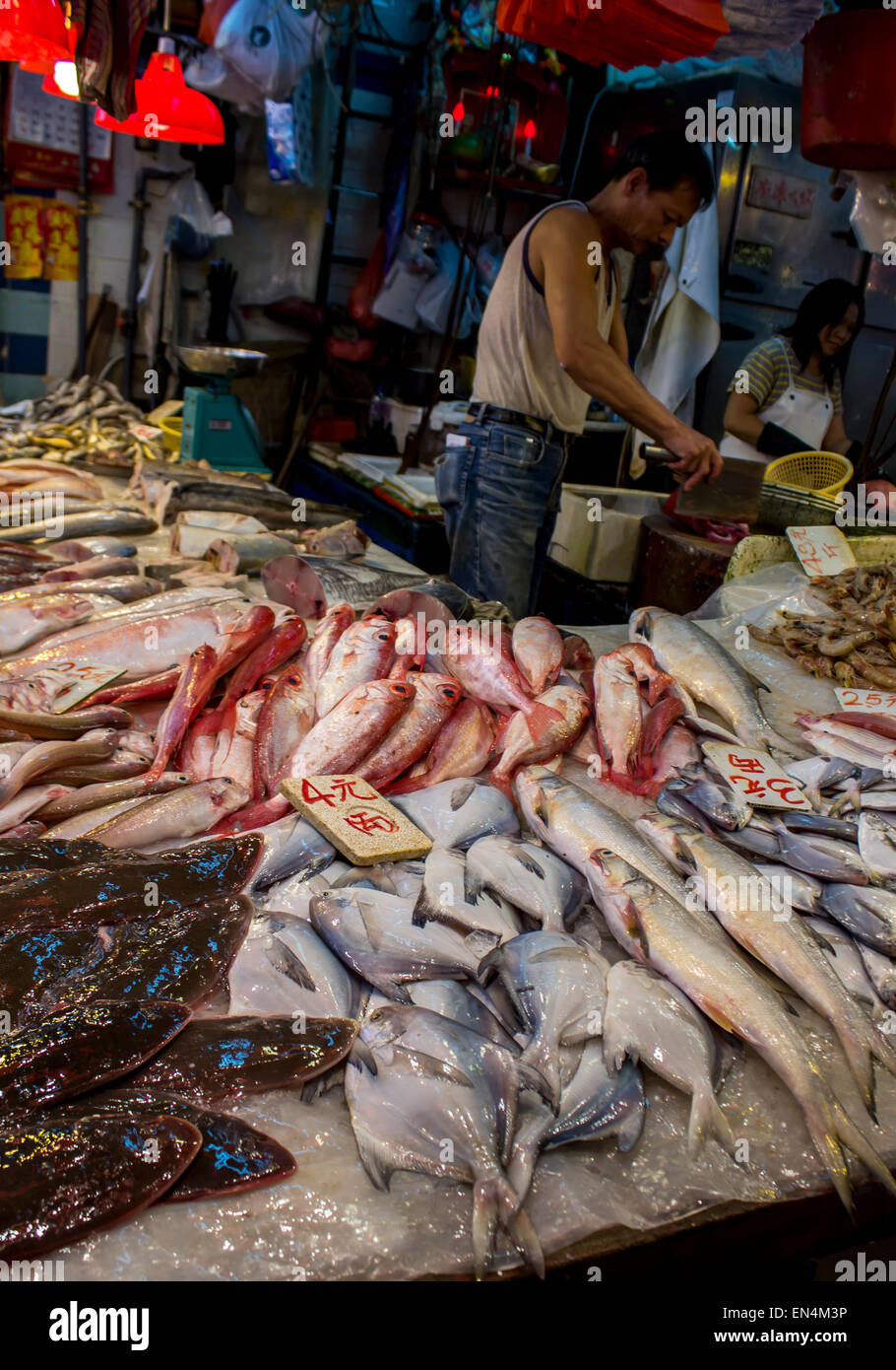 Wet Market Hong Kong China jumping live fish sale stacked ready purchase Stock Photo