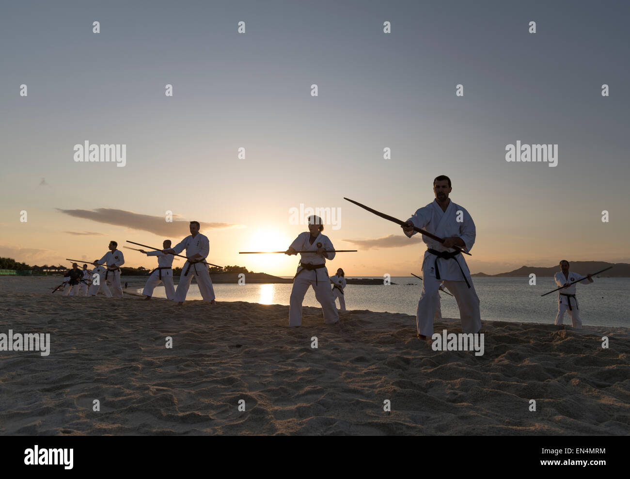 Bo staff kobudo training on Kirakira beach in Okinawa, Japan - the birthplace of karate. Stock Photo