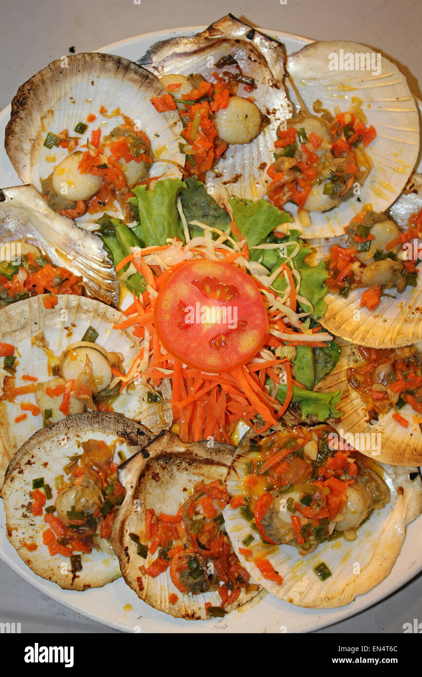 Scallops For Sale In a Thai Night Market garnished With Fried Onions And A Spicy Sauce Stock Photo