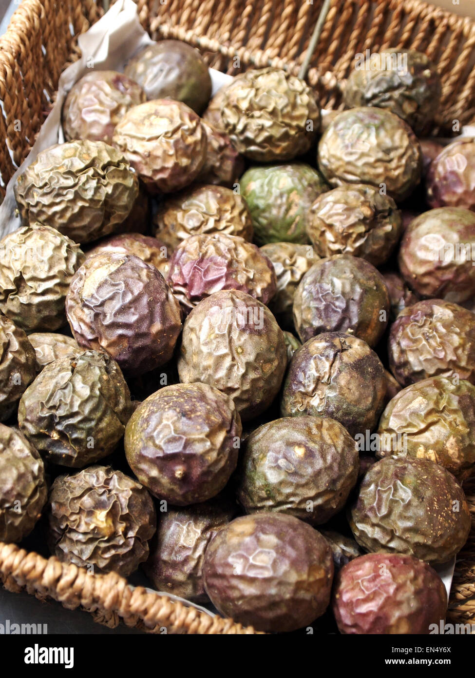 passion fruit in a basket. Photography by Qin Xie Stock Photo - Alamy