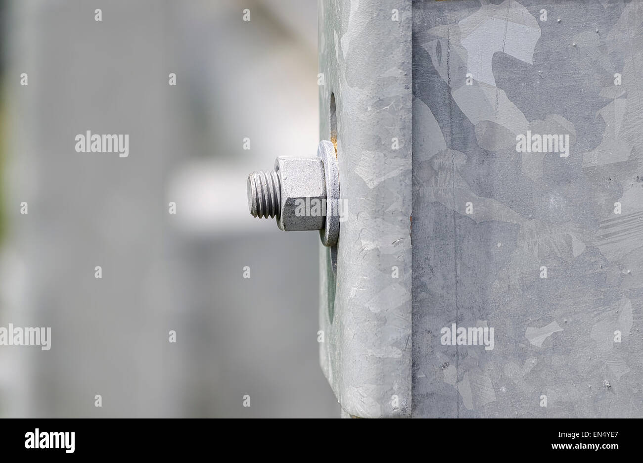 Bolt with screw and washer, located on a guard rails, near a road Stock Photo