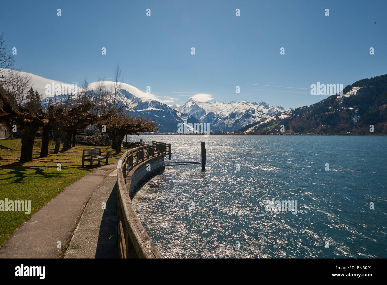 On the Lake side of the lake Zell Austria in the Alps. in the backdrop snow covered alps Stock Photo