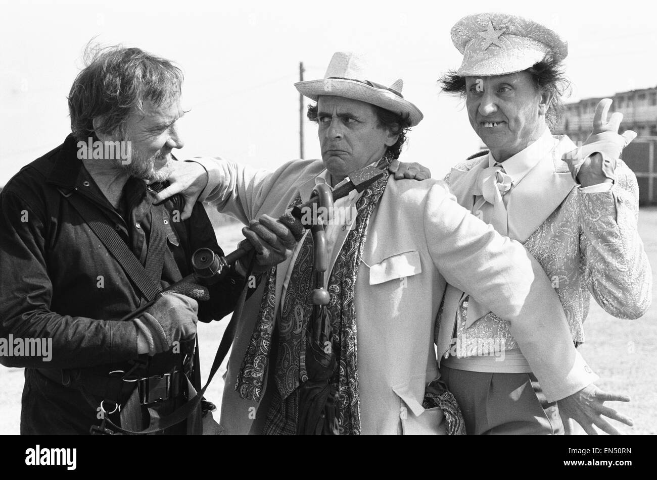 Left to Right Actor Don Henderson as Gavrok, Sylvester McCoy as Doctor Who and Ken Dodd as Tollmaster seen here filming at the Majestic Holiday Camp on Barry Island, South Glamorgan, Wales for the Dr Who TV serial 'Delta and the Bannermen' 29th June 1987 Stock Photo