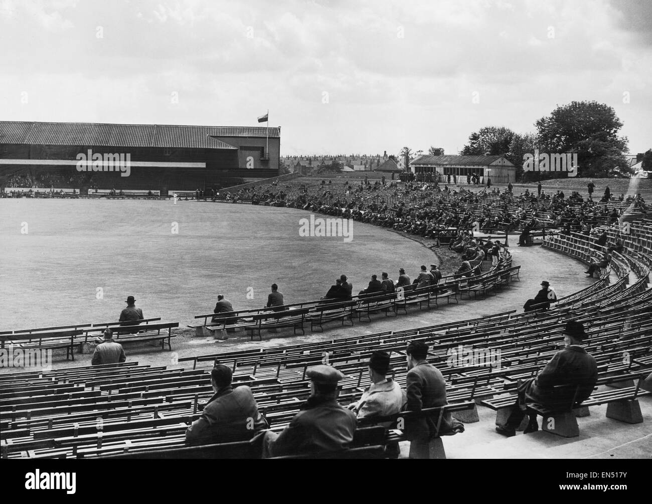 Spectators watching the action at Headingley, the ground of Yorkshire Cricket Club in Leeds. c.1935. Stock Photo