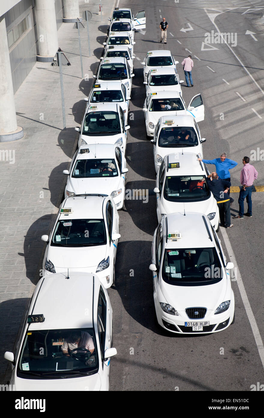 Line of white taxis queuing outside Malaga airport, Spain Stock Photo