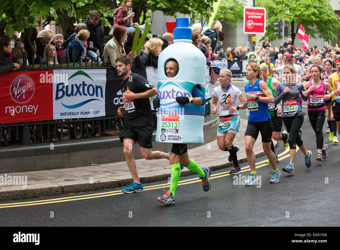 Man dressed as a bottle of Buxton water running at the 2015 Virgin ...