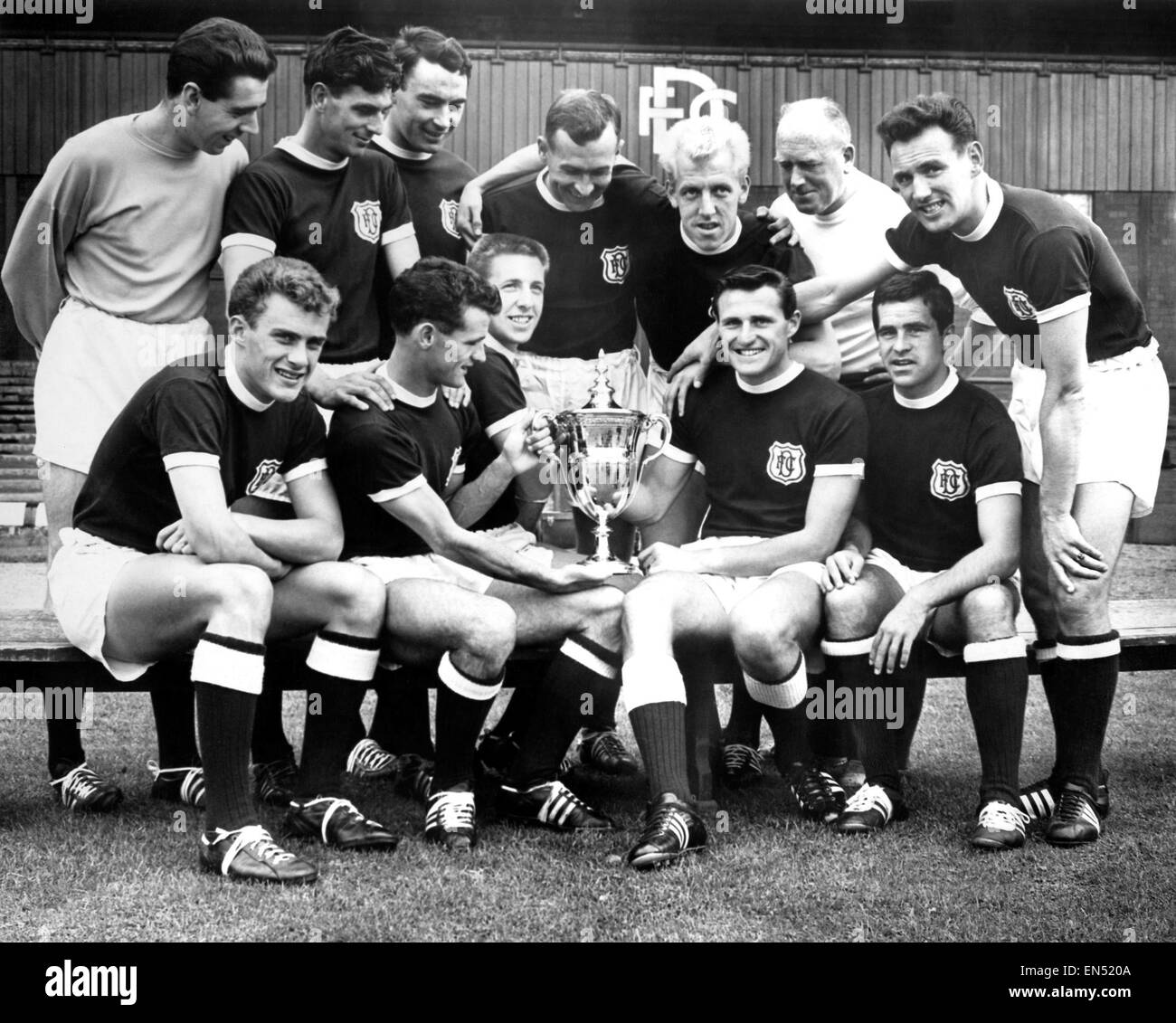 Dundee Scottish League champions, 1961/62, Photocall with trophy, Back row  left to right: Pat Liney, Gordon Smith, Alan Gilzean, Bobby Wishart, Ian  Ure, trainer Sammy Kean and right half Bobby Seith, Front