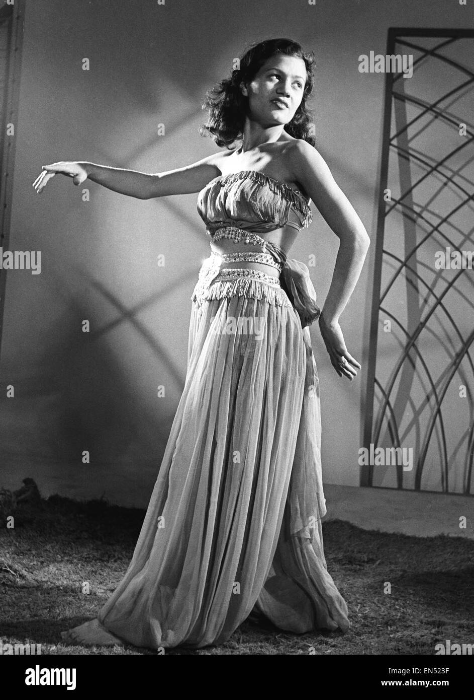 Kawahkib, an Arab slave girl who was smuggled into England from Iraq by young British seaman Tommy Flynn, pictured playing her part in the Christmas pantomime 'Aladdin and His Magic Lamp'. 10th December 1953. Stock Photo