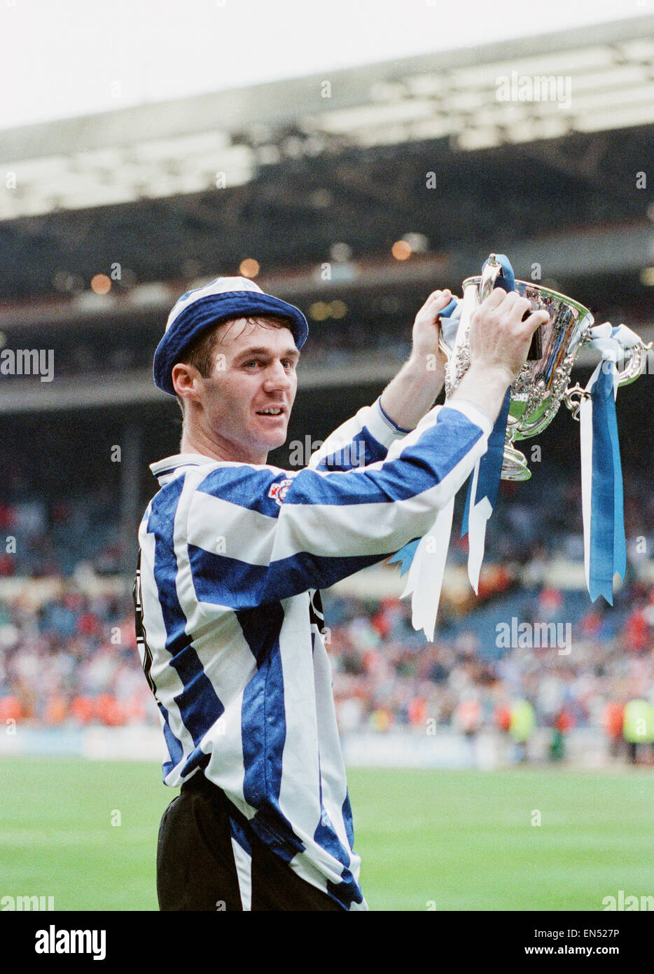 Rumbelows Cup Cup Final at Wembley Stadium. Sheffield Wednesday 1 v Manchester United 0. Wednesday's John Sheridan, who scored the winning goal, proudly holds aloft the trophy during celebrations at the end of the match. 21st April 1991. Stock Photo