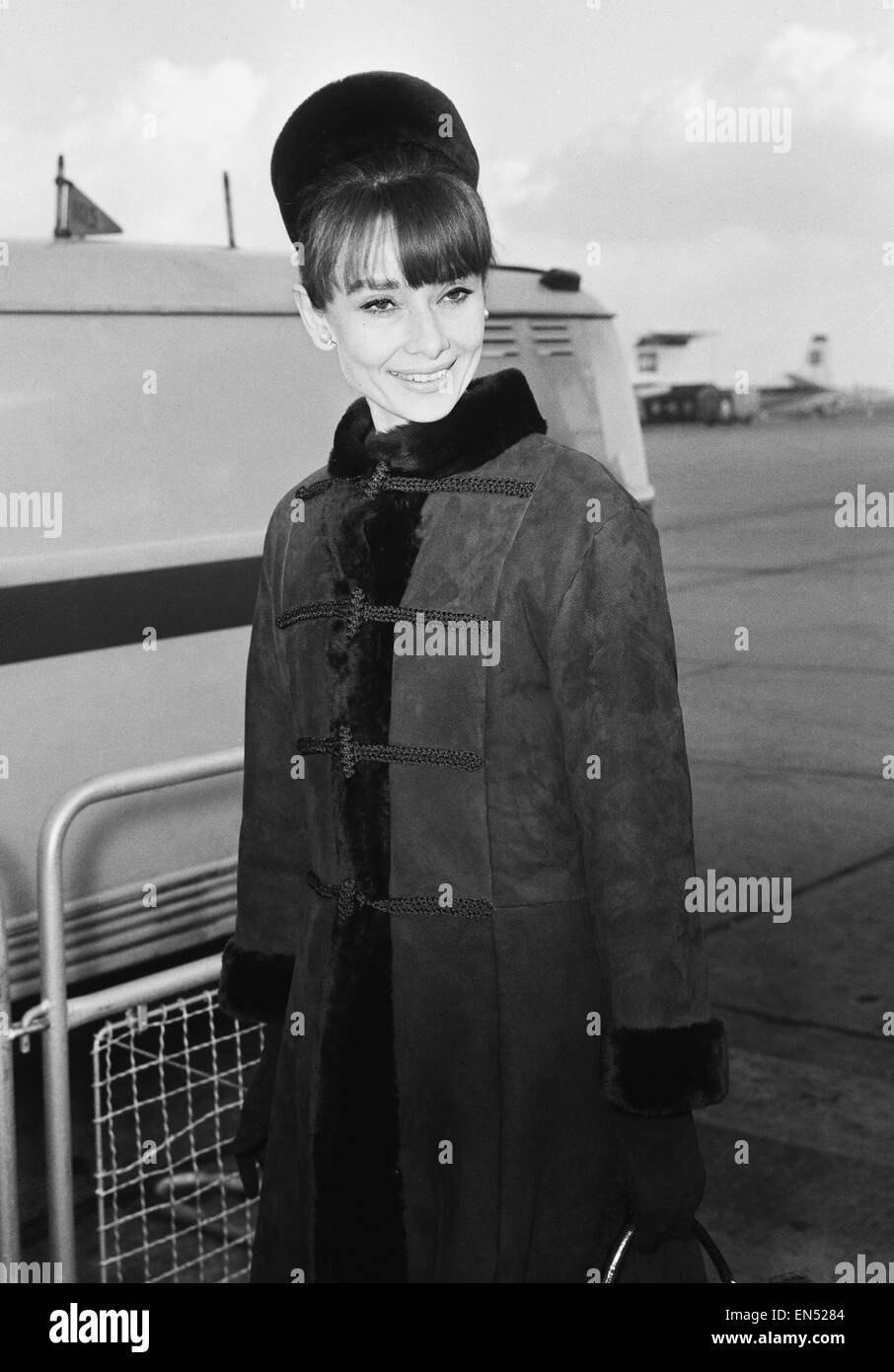 Actress Audrey Hepburn arriving in London from Zurich for the Royal Charity Premiere of her latest film 'My Fair Lady', taking place at the Warner Theatre. 19th January 1965. Stock Photo