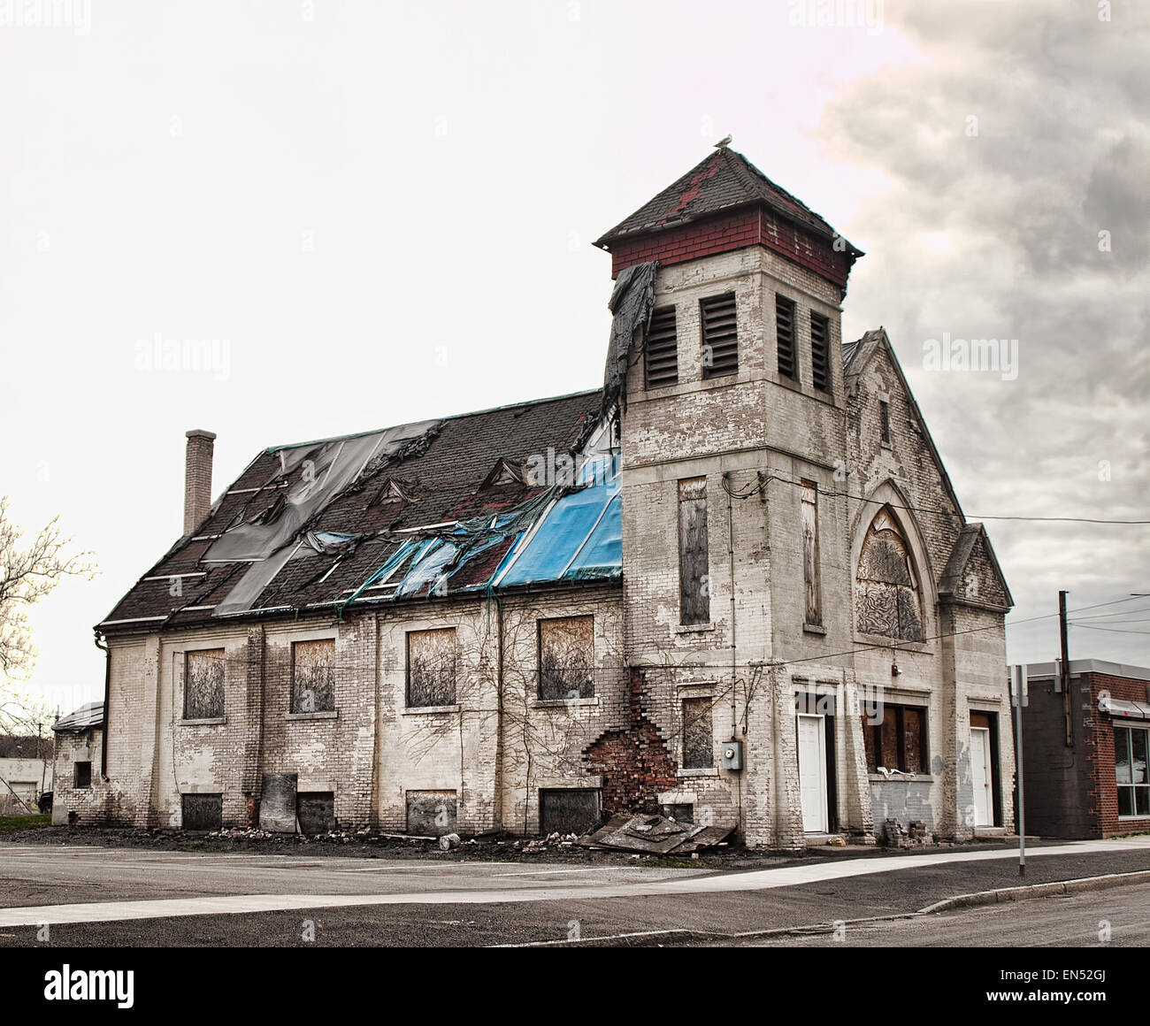 old church in ruins in poverty stricken section of a city Stock Photo