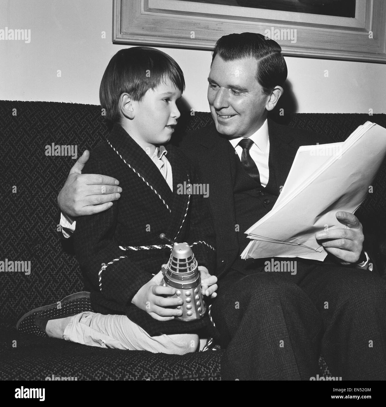 Peter Hawkins the man behind the voice of the Daleks seen here reading through his script for the latest Dr Who adventure with his son Silas aged 6 8th November 1965 Stock Photo