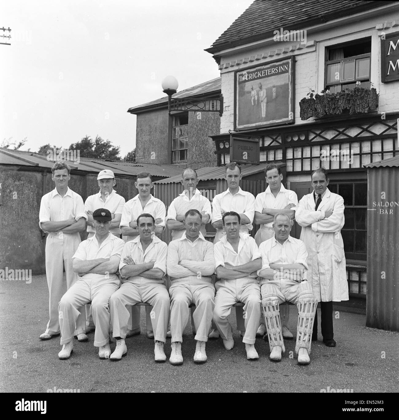 A cricket team poses outside The Cricketers public house in Meopham in Kent Circa June 1950 Stock Photo