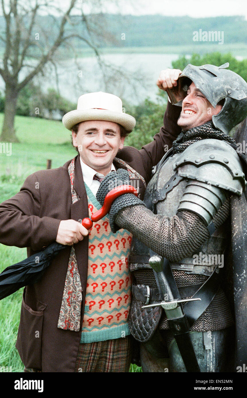 Christopher Bowen as Mordred crosses swords with Sylvester McCoy as the Doctor whilst on location filming for the Dr Who story Battlefield. 16th May 1989 Stock Photo