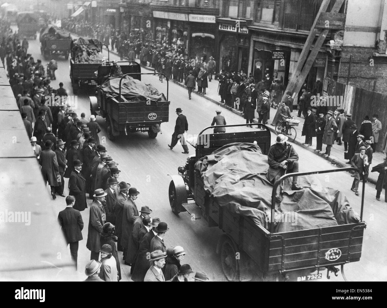 Soldiers ride shotgun as a food convoy passes through central London ...