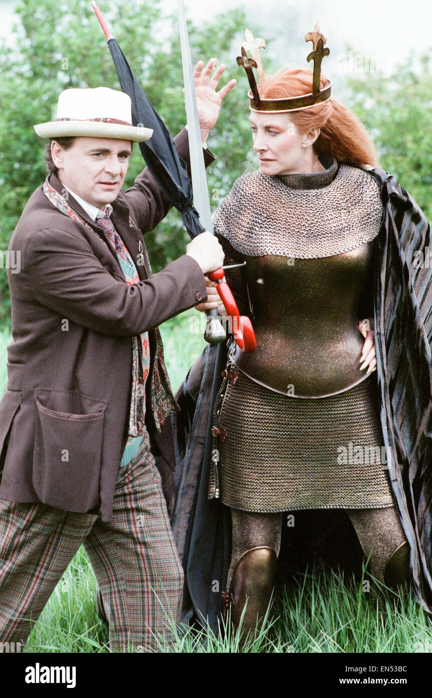 Sylvester McCoy as the Doctor with Jean Marsh as Morgaine whilst on location filming for the Dr Who story Battlefield. 16th May 1989 Stock Photo