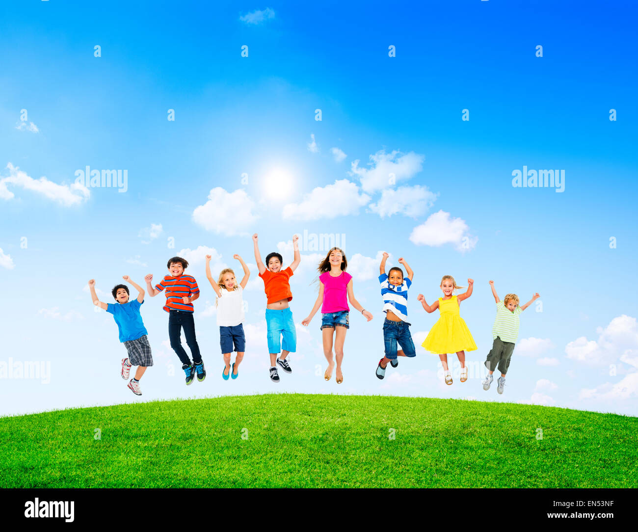 Group of Diverse Multi-Ethinc Children Jumping Outdoors Stock Photo - Alamy