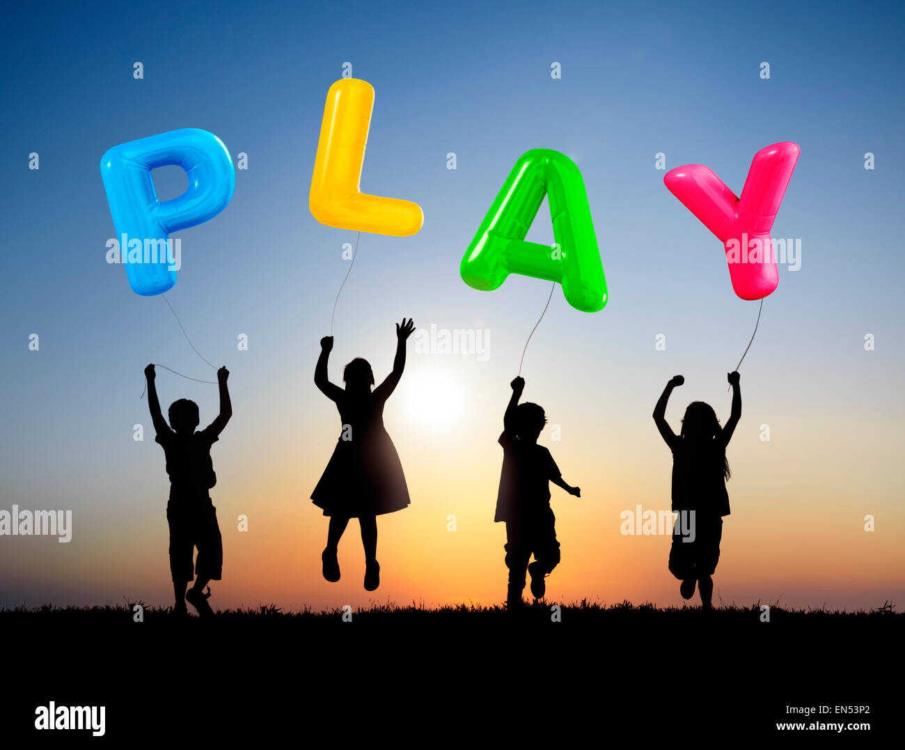 Little Children Jumping and Holding Balloons that Forms Play Stock Photo